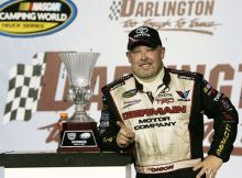 Todd Bodine, driver of the No. 30 Germain.com Toyota, celebrates in Victory Lane after winning the NASCAR Camping World Truck Series Too Tough To Tame 200 at Darlington Raceway Saturday in Darlington, S.C. Credit: Mary Ann Chastain/Getty Images for NASCAR